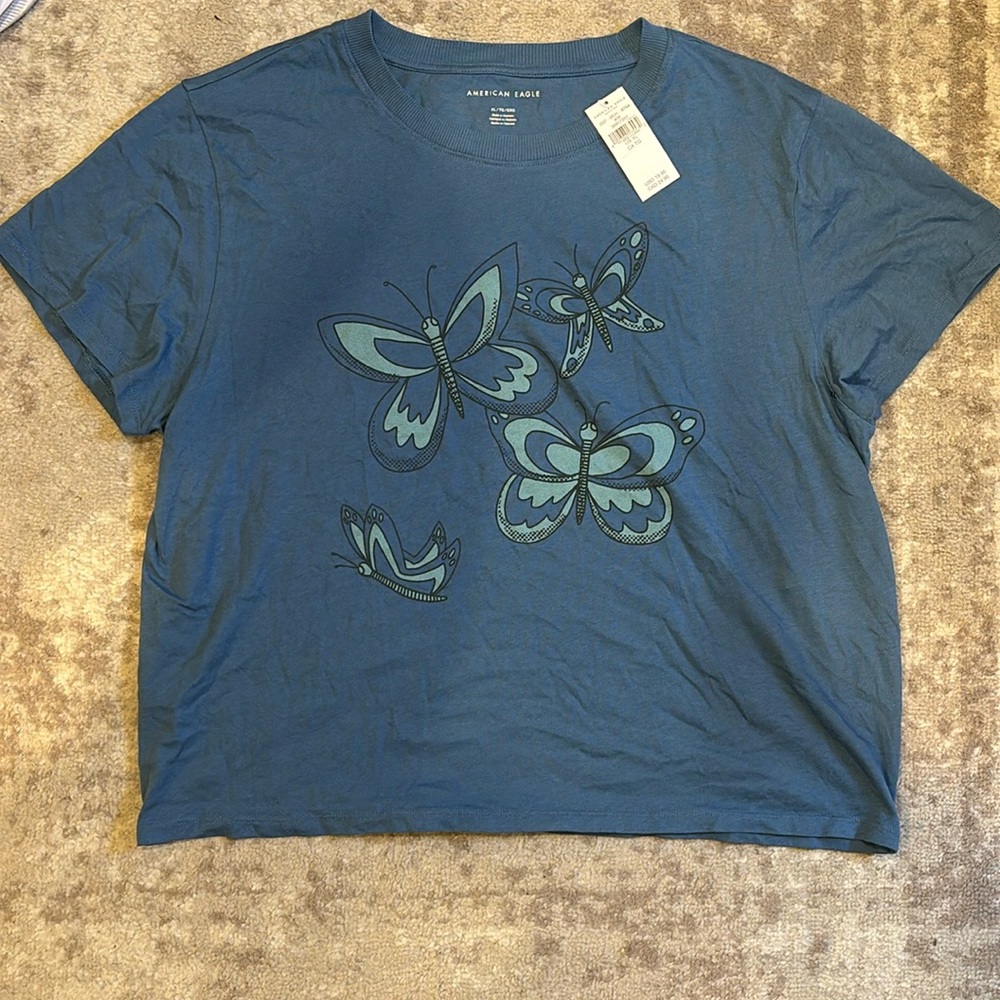 Blue short sleeve t shirt with butterflies